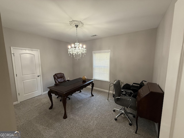 office area with carpet floors, a notable chandelier, visible vents, and baseboards