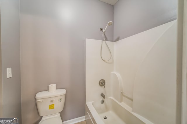 bathroom featuring  shower combination and toilet