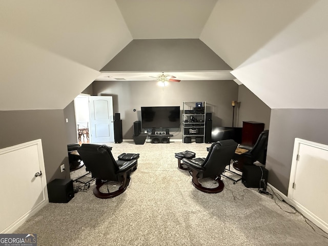 interior space featuring lofted ceiling, a ceiling fan, and carpet flooring