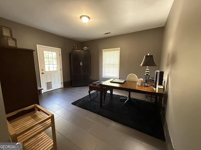 office with visible vents and tile patterned flooring