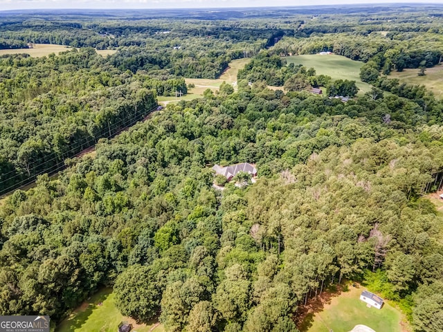 drone / aerial view with a view of trees