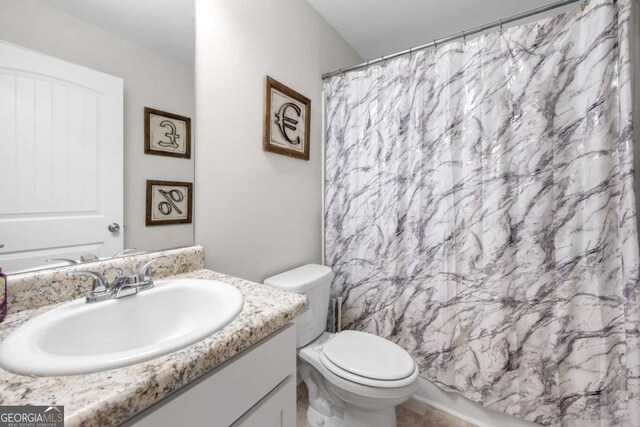 full bathroom with tile patterned flooring, toilet, vanity, and a shower with curtain