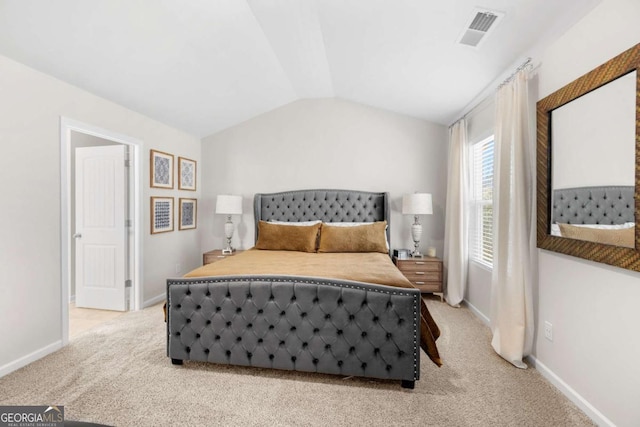 bedroom featuring light carpet, visible vents, baseboards, and lofted ceiling