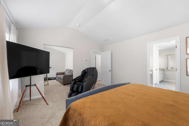 bedroom with lofted ceiling and light carpet