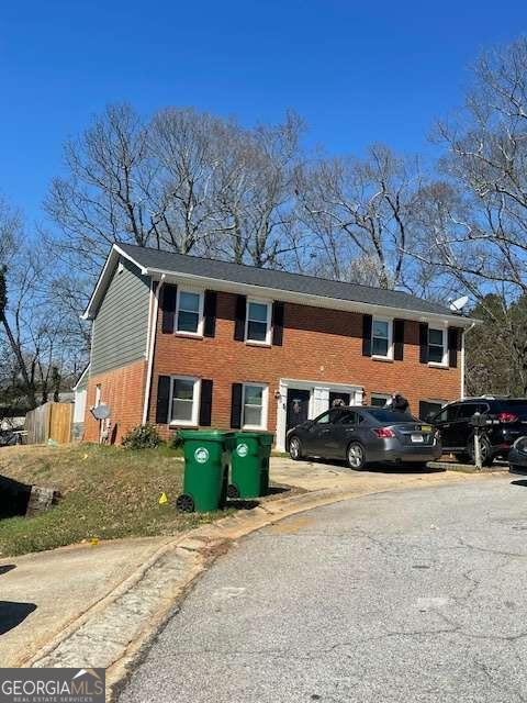 view of property exterior with brick siding