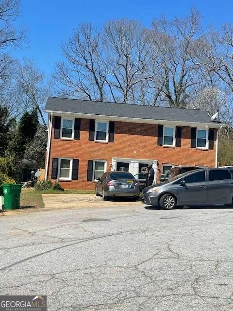 view of front of house with brick siding