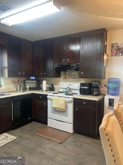 kitchen with range hood, electric stove, light wood-type flooring, and black dishwasher