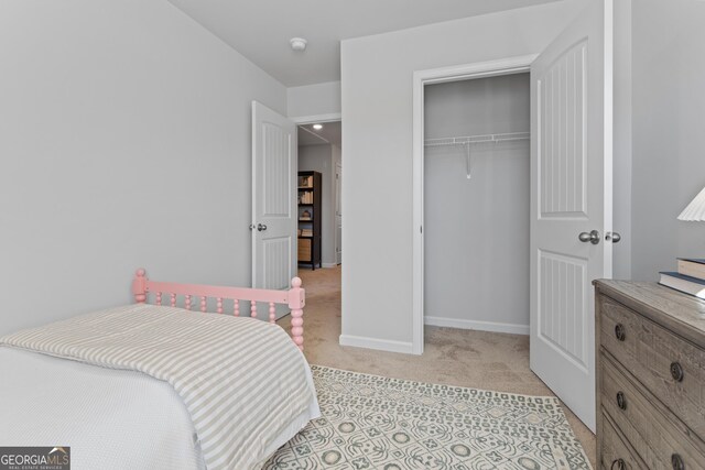 233 Ivey Ter Unit 39, Temple, GA 30179 - bedroom with light colored carpet, a closet, and baseboards