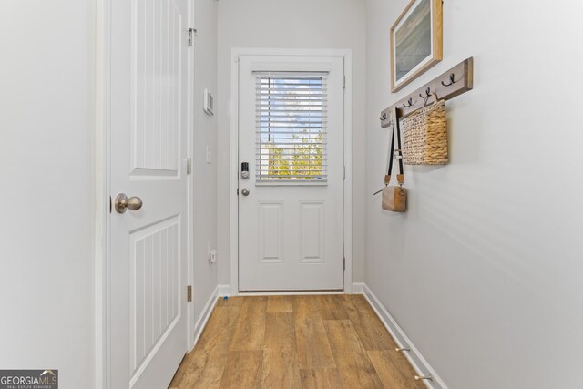 233 Ivey Ter Unit 39, Temple, GA 30179 - doorway with light wood-style floors and baseboards