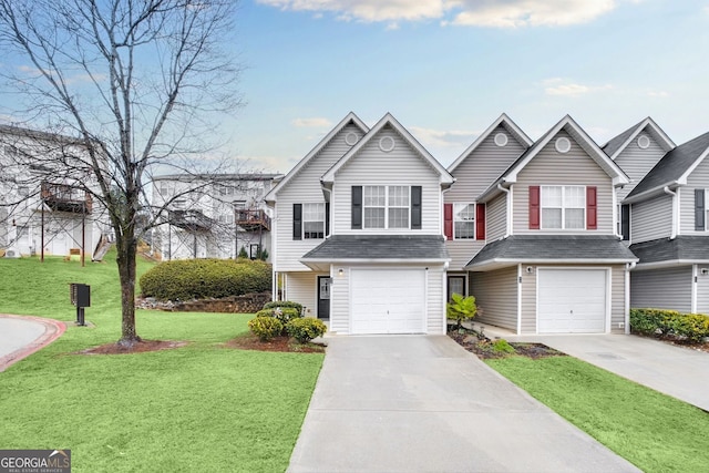 view of front of property with a front yard, a garage, and driveway