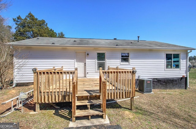 rear view of house with crawl space, cooling unit, and a wooden deck