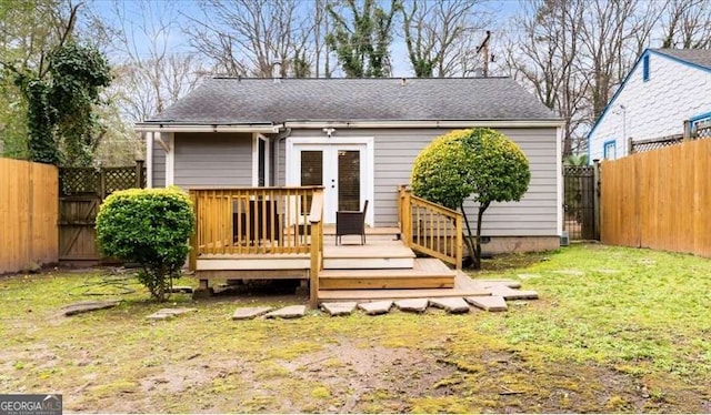 back of house with a wooden deck, a yard, a fenced backyard, french doors, and crawl space