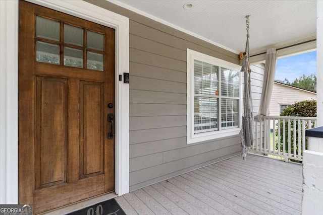 doorway to property featuring covered porch