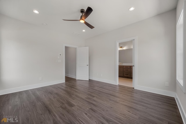 unfurnished bedroom featuring dark wood finished floors, recessed lighting, and baseboards