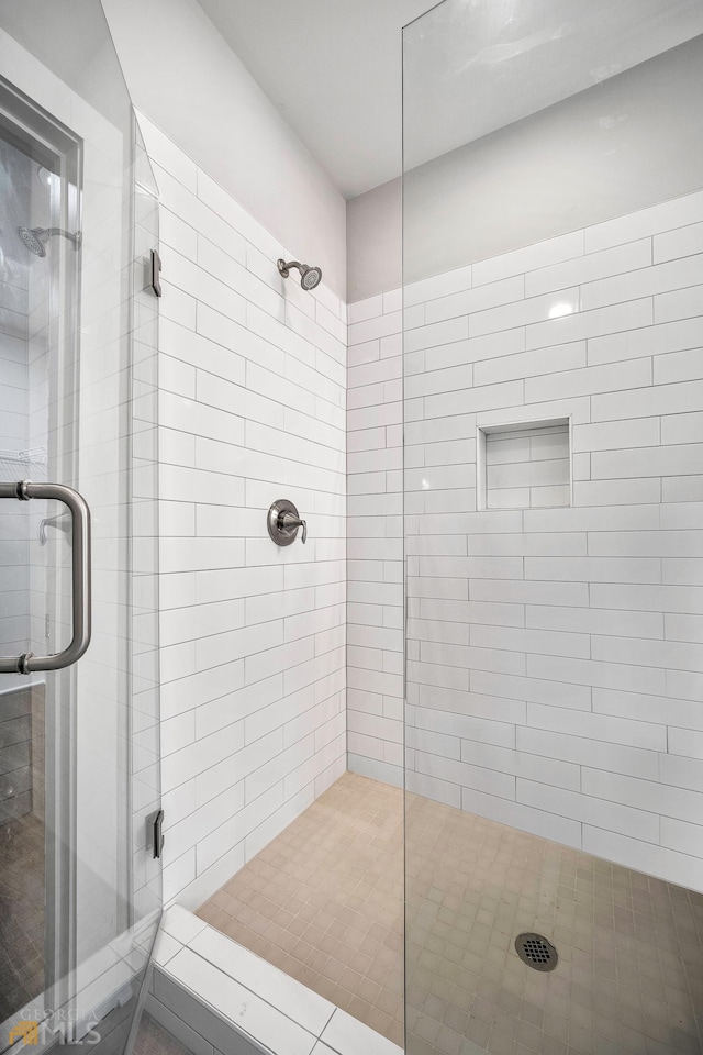 bathroom featuring a shower stall