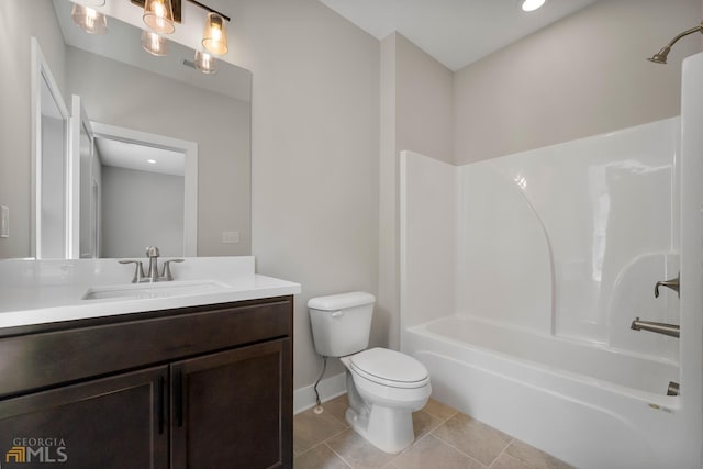 full bath with vanity, baseboards, tile patterned flooring, shower / washtub combination, and toilet