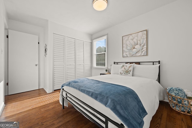 bedroom featuring a closet and wood finished floors