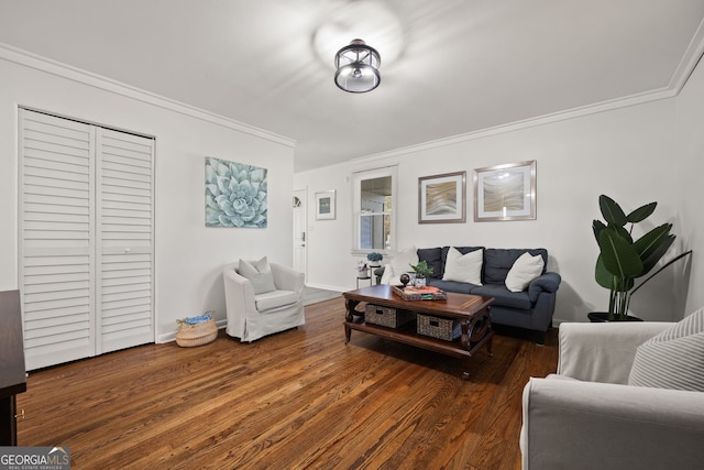 living room with crown molding, baseboards, and wood finished floors