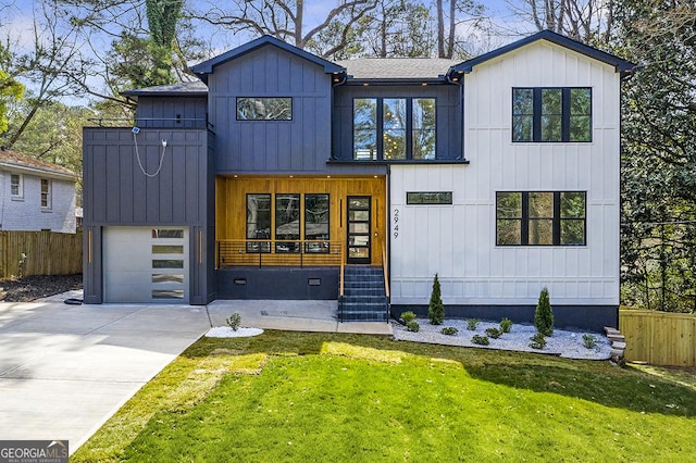 modern inspired farmhouse with fence, board and batten siding, concrete driveway, a front yard, and a garage