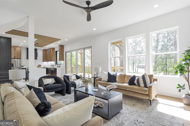 living area featuring light wood finished floors, recessed lighting, and ceiling fan