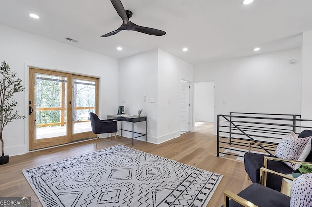 living area with a ceiling fan, recessed lighting, wood finished floors, and visible vents