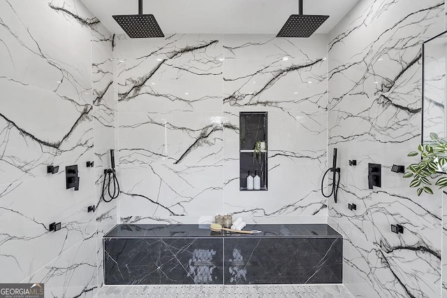 full bathroom with a marble finish shower