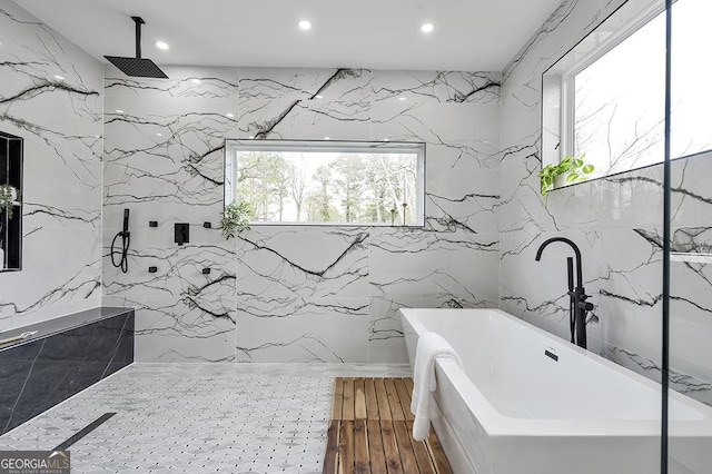 full bath with recessed lighting, a marble finish shower, a soaking tub, and wood finished floors