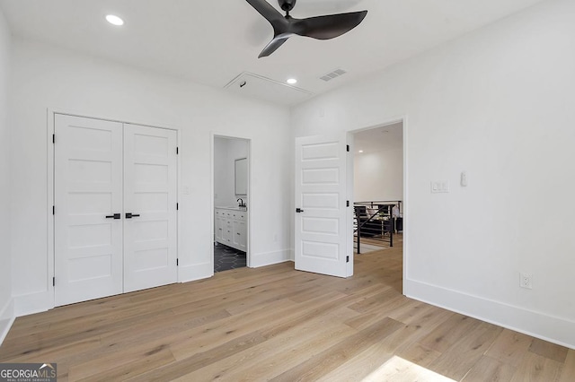 unfurnished bedroom with baseboards, visible vents, and light wood finished floors