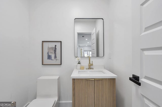 half bath with toilet and vanity