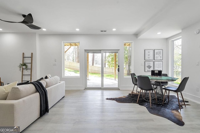 dining room featuring a ceiling fan, visible vents, baseboards, recessed lighting, and light wood-style floors