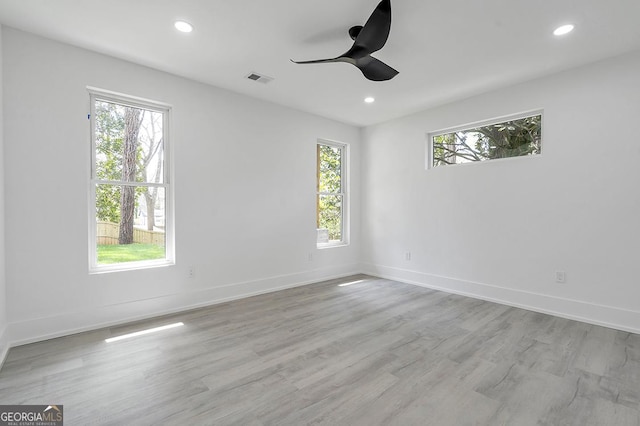 spare room with visible vents, ceiling fan, baseboards, recessed lighting, and wood finished floors