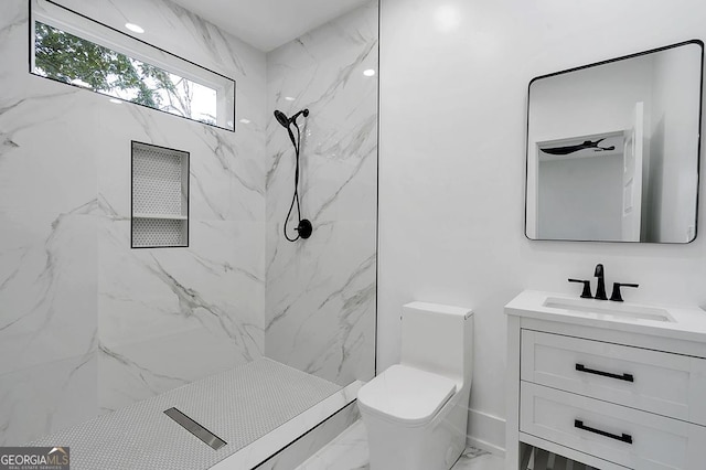 full bathroom with a marble finish shower, toilet, marble finish floor, and vanity