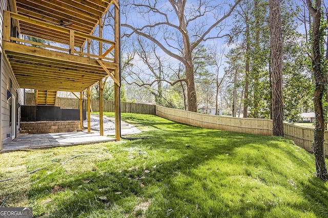 view of yard with a fenced backyard and a patio