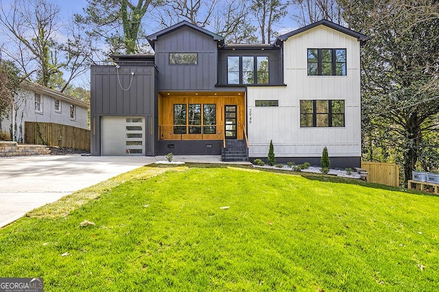 view of front of home featuring fence, entry steps, a front yard, driveway, and an attached garage