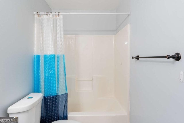 bathroom with toilet and shower / bath combination