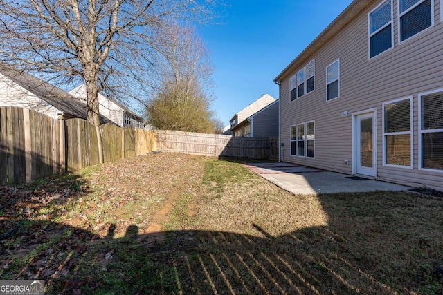 view of yard with a patio and a fenced backyard