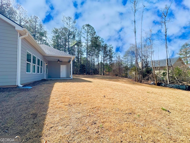 view of yard with ceiling fan