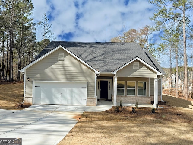 view of front facade featuring brick siding, concrete driveway, a garage, and a shingled roof