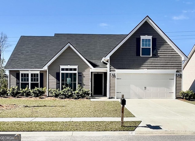 view of front facade featuring concrete driveway and an attached garage