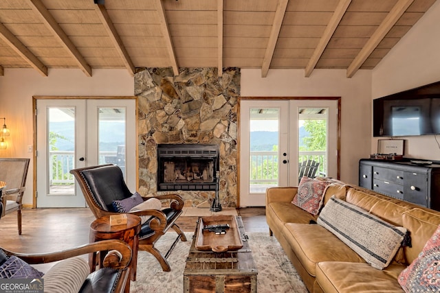 living room with wood ceiling, plenty of natural light, and french doors