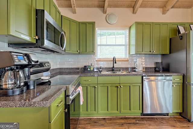 kitchen featuring a sink, tasteful backsplash, appliances with stainless steel finishes, and wooden ceiling