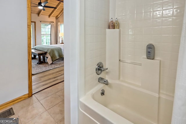 ensuite bathroom featuring tile patterned floors, visible vents, ensuite bathroom, wooden ceiling, and bathing tub / shower combination