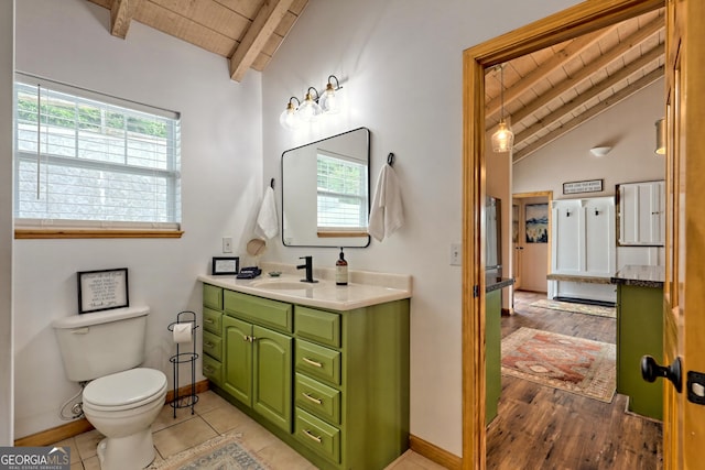 bathroom with vanity, baseboards, vaulted ceiling with beams, wooden ceiling, and toilet