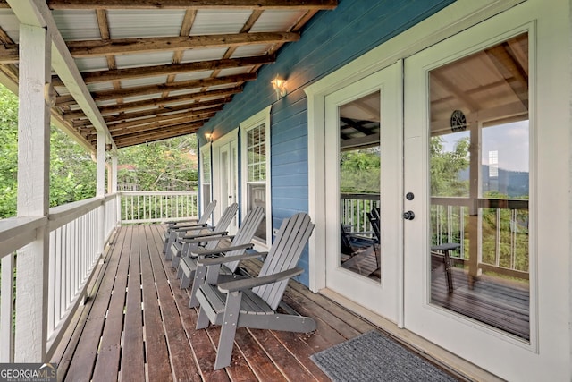 wooden terrace featuring french doors