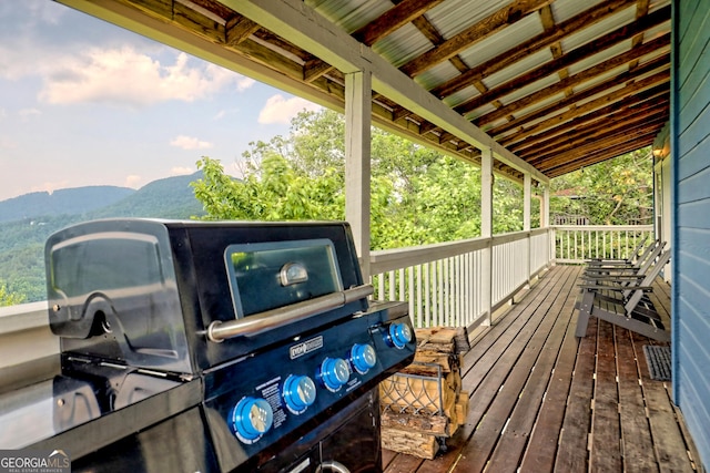 deck featuring a mountain view and grilling area