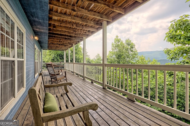 wooden terrace featuring a mountain view