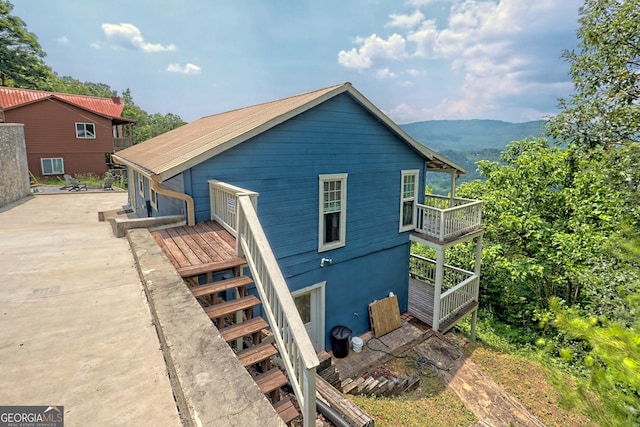 rear view of property with a mountain view