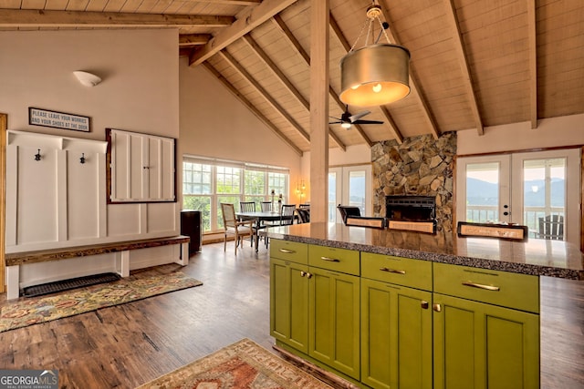 kitchen featuring open floor plan, wood finished floors, french doors, wooden ceiling, and green cabinetry