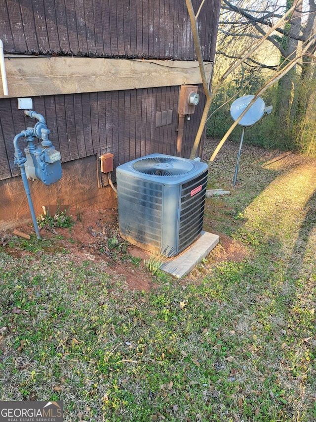 exterior details with gas meter and central air condition unit