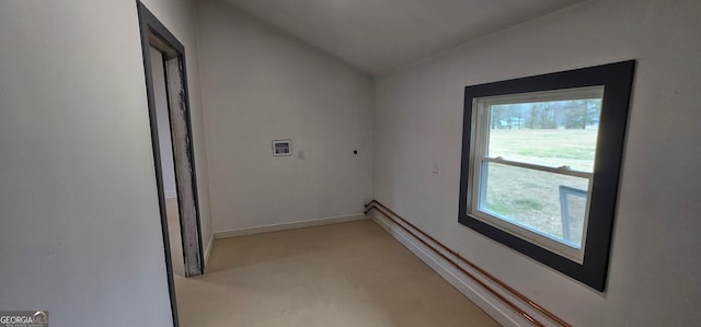 interior space with laundry area, electric dryer hookup, baseboards, and washer hookup